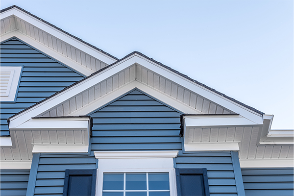 A home with vinyl siding. Vinyl siding maintenance is an important aspect of home maintenance. 